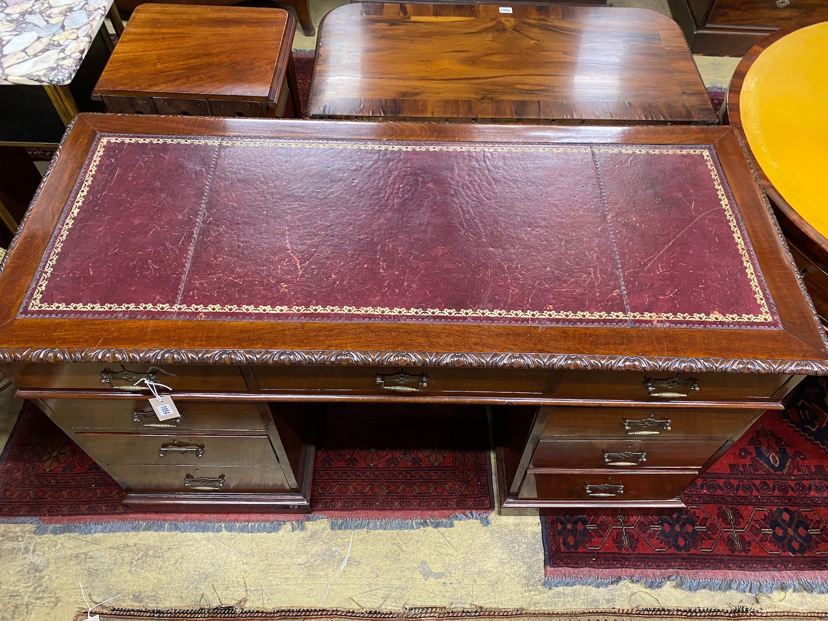An early 20th century mahogany pedestal desk, width 136cm, depth 59cm, height 77cm